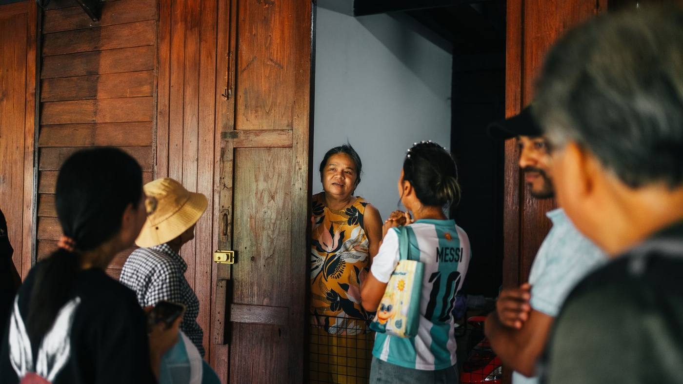 A conversation at a doorway